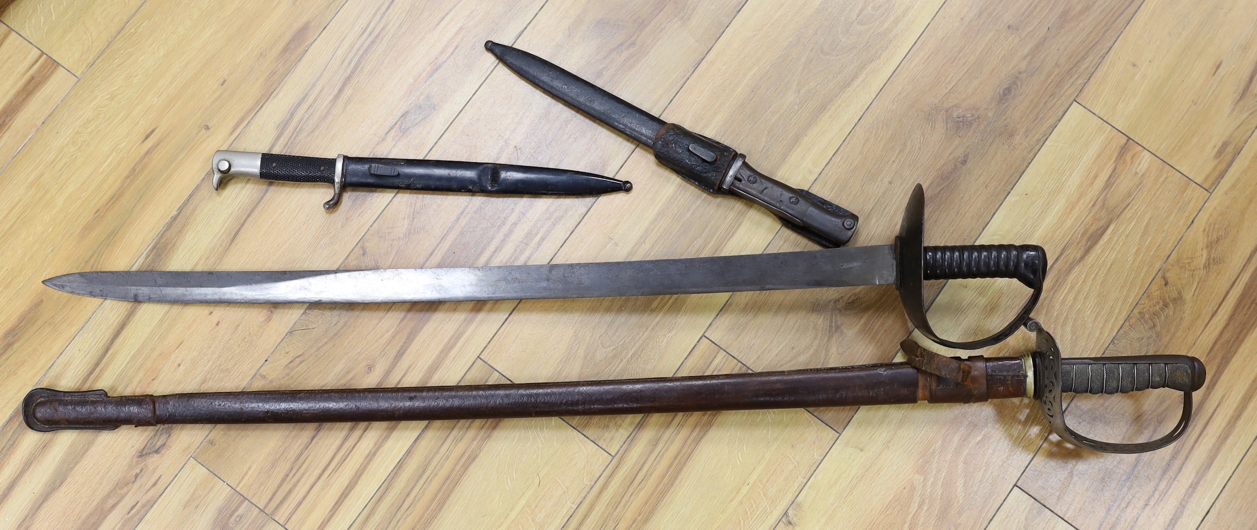 A 19th century Naval sword marked Wilkinson and a Hawks and Co. George V officer's dress sword and two bayonets